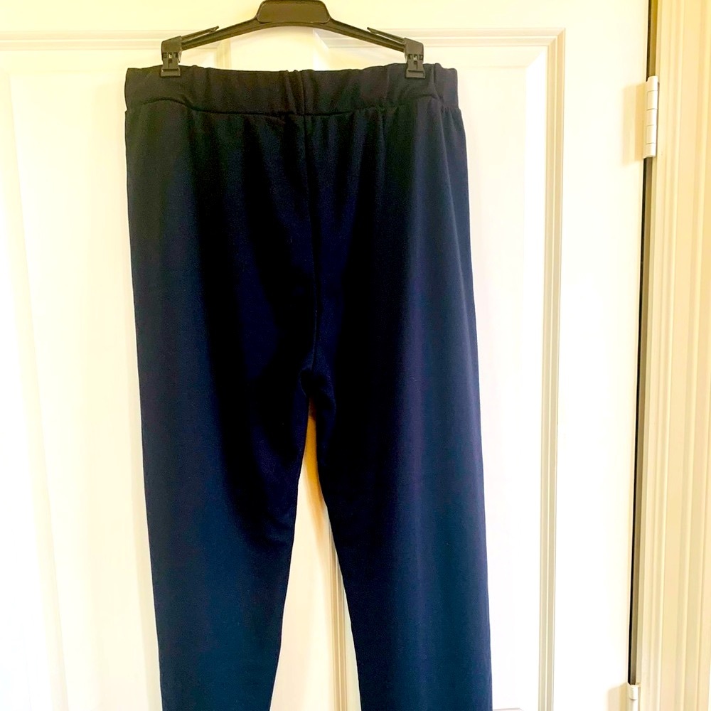 European made relaxed slacks. Polyester, semi flexible. No button or zipper.